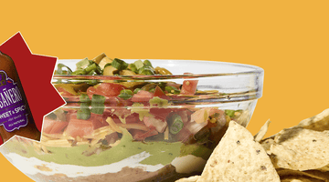 A Game Day Seven-Layer Dip Recipe that Wins Big Featuring Tabañero Sweet and Spicy Hot Sauce